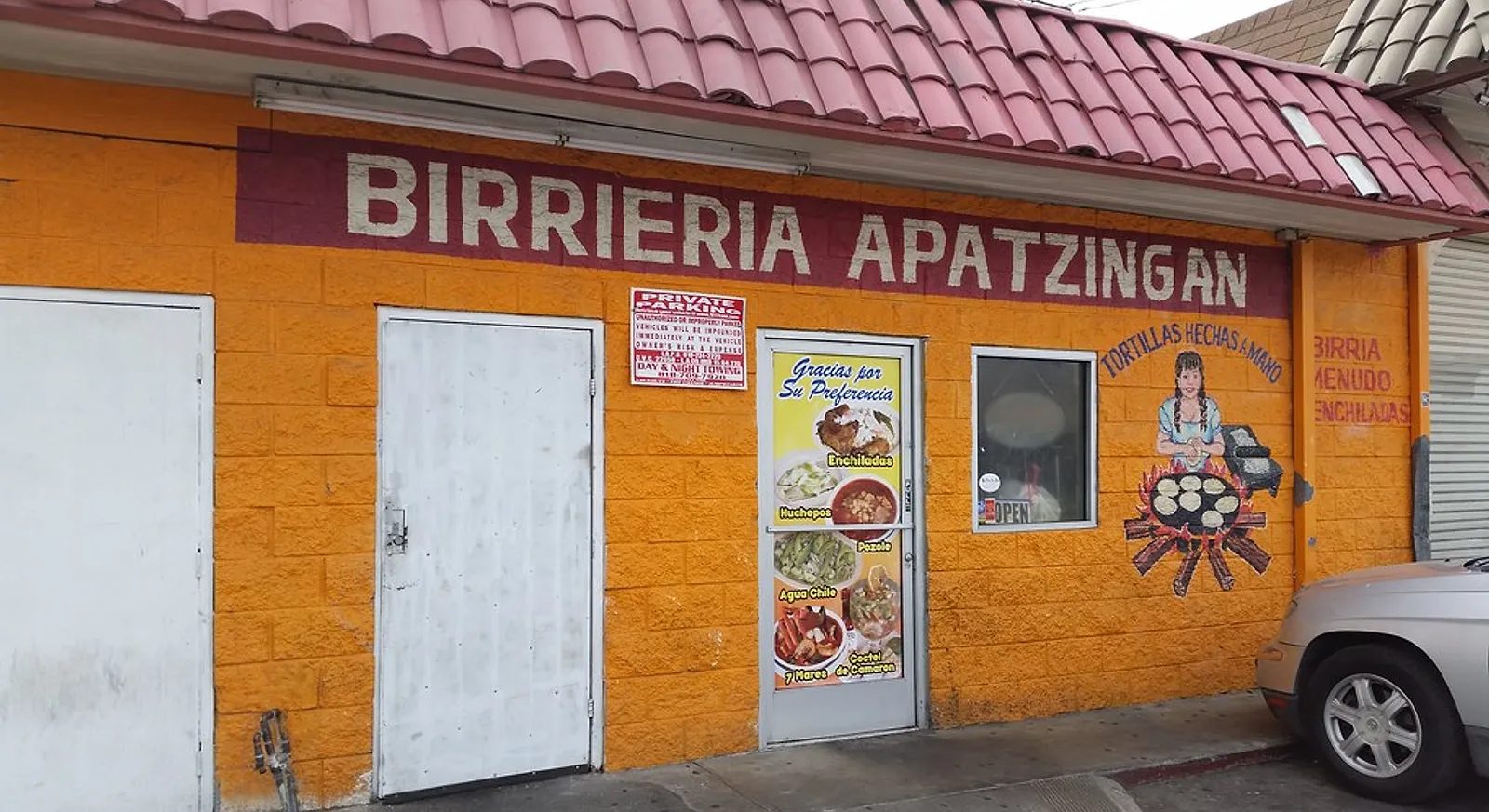 The orange storefront of Birrieria Apatzingan