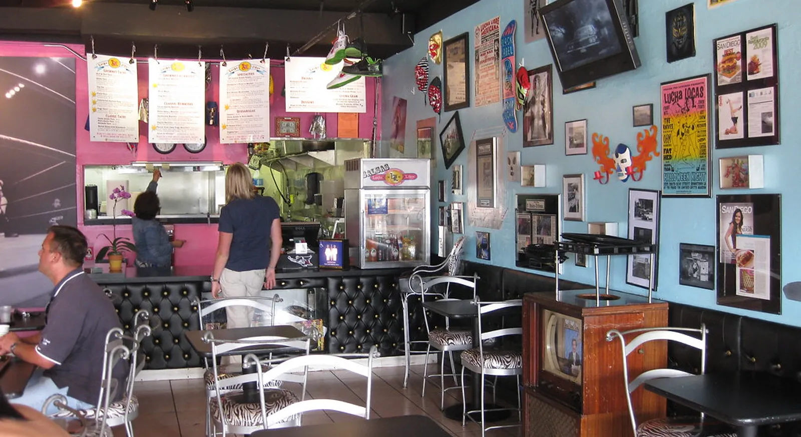 The colorful dining room of Lucha Libre Gourmet Taco Shop