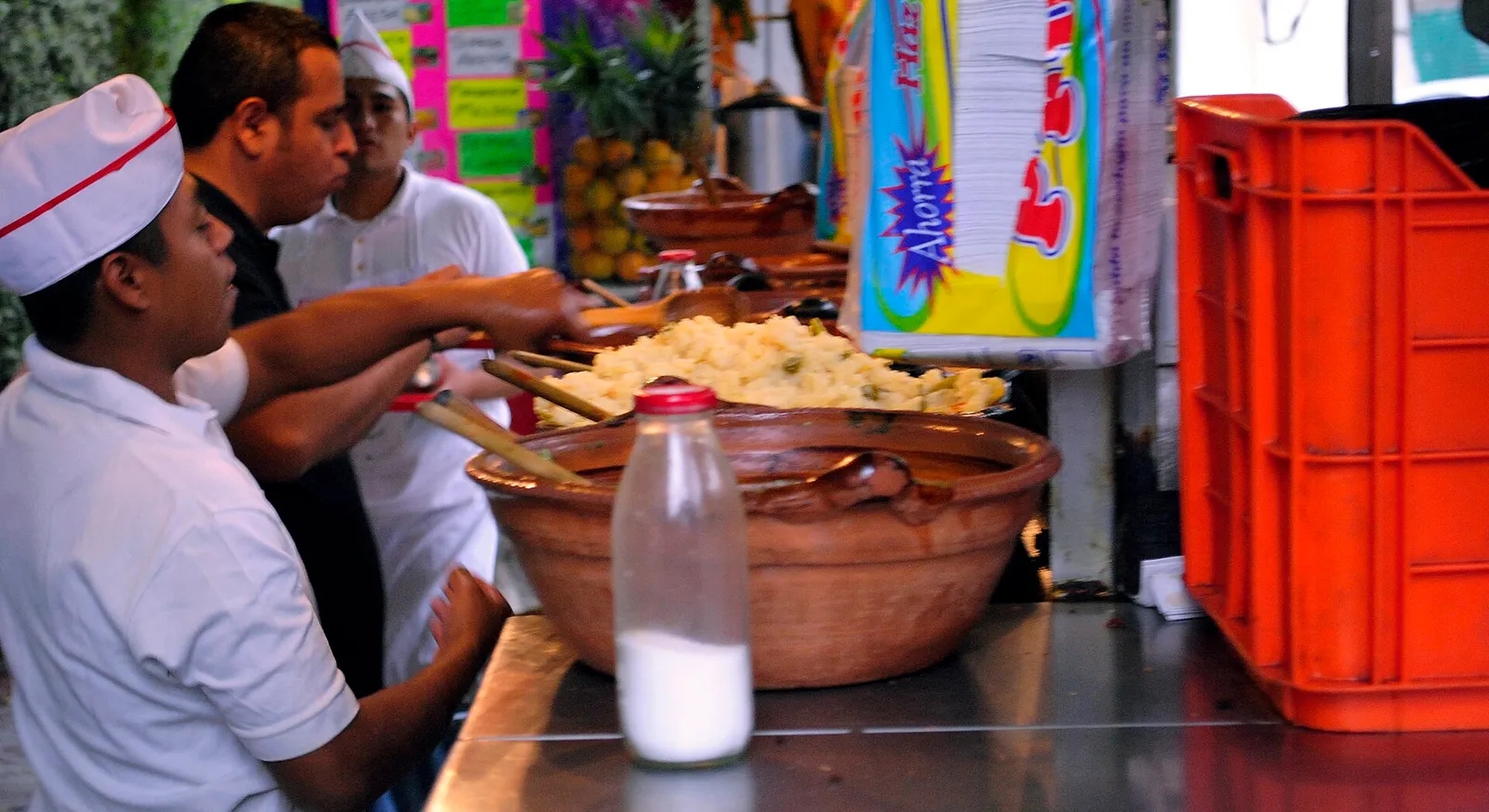 Cooks serving tacos at Super Tacos Chupacabras, a street taco stand in Mexico City