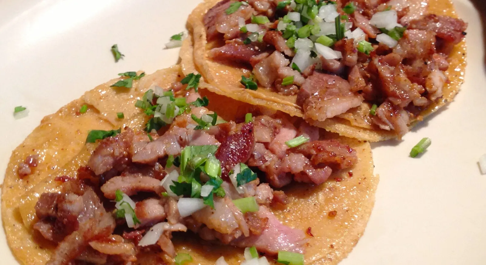 Street tacos with grilled meat, onion and cilantro in Mexico City