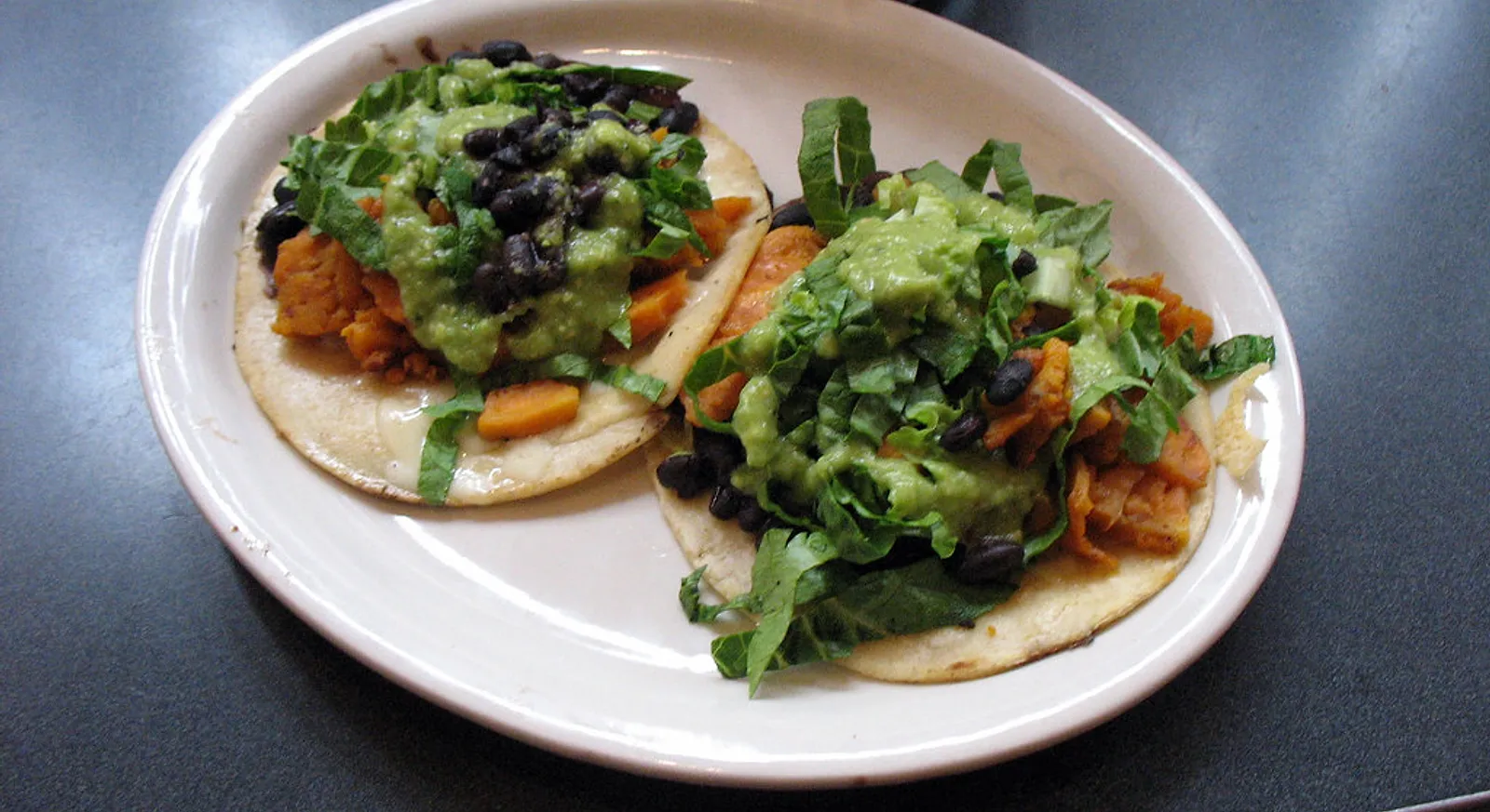Veggie tacos with black beans and greens from Taqueria Pacifica